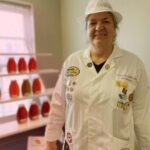 Karla Eisen in Lab Coat Judging Honey