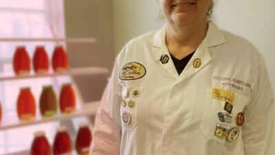 Karla Eisen in Lab Coat Judging Honey